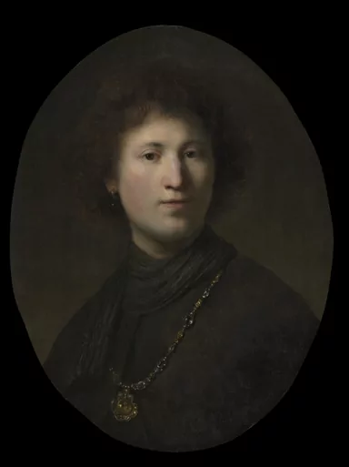 An oval portrait against near black: a young man with dark curling hair turns towards us in a dark cloak and grey scarf, a gold chain and medallion across his chest.