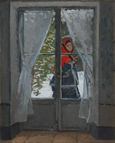 A woman in a red headscarf and dark coat passes outside a grey French window, seen through its panes between white lace curtains, with snow and green shrubs beyond.